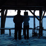 Grant (Gordon Pinsent) and Fiona (Julie Christie) silhouetted looking out on the frozen lake in Away From Her